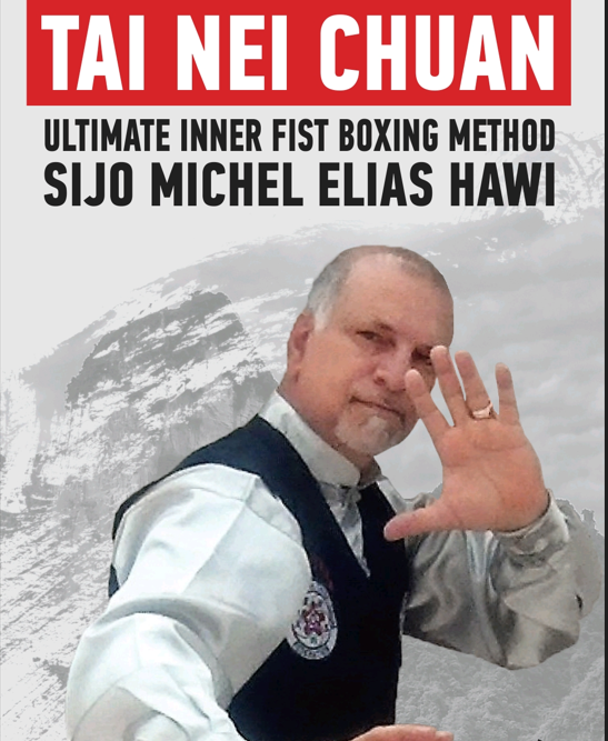 Sijo Michel Elias Hawi, founder of Tai Nei Chuan, in martial arts attire with hand raised in a traditional gesture